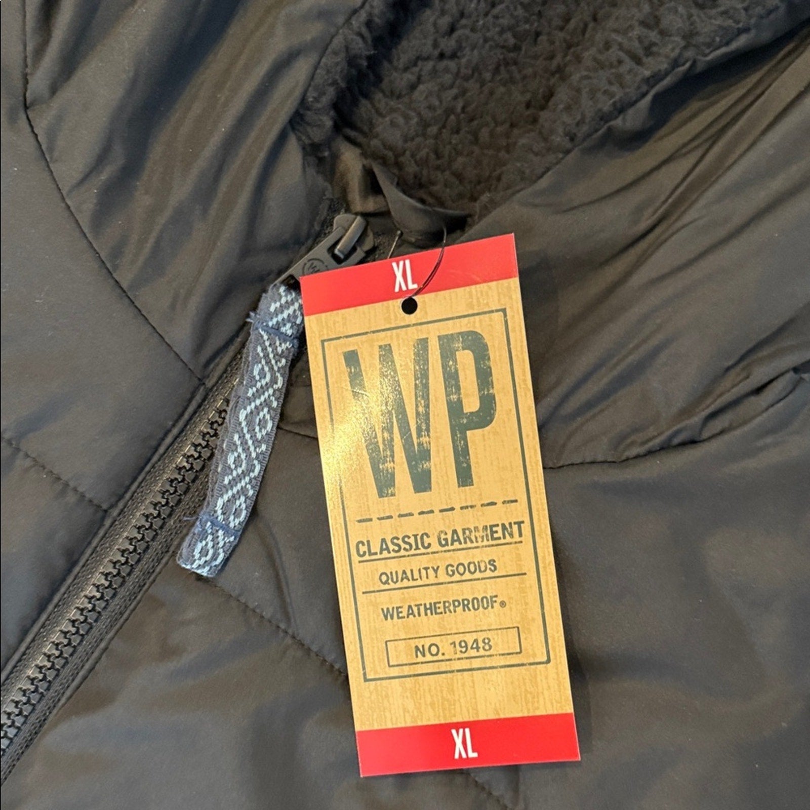 Weather proof woman’s long packable jacket XL NEW